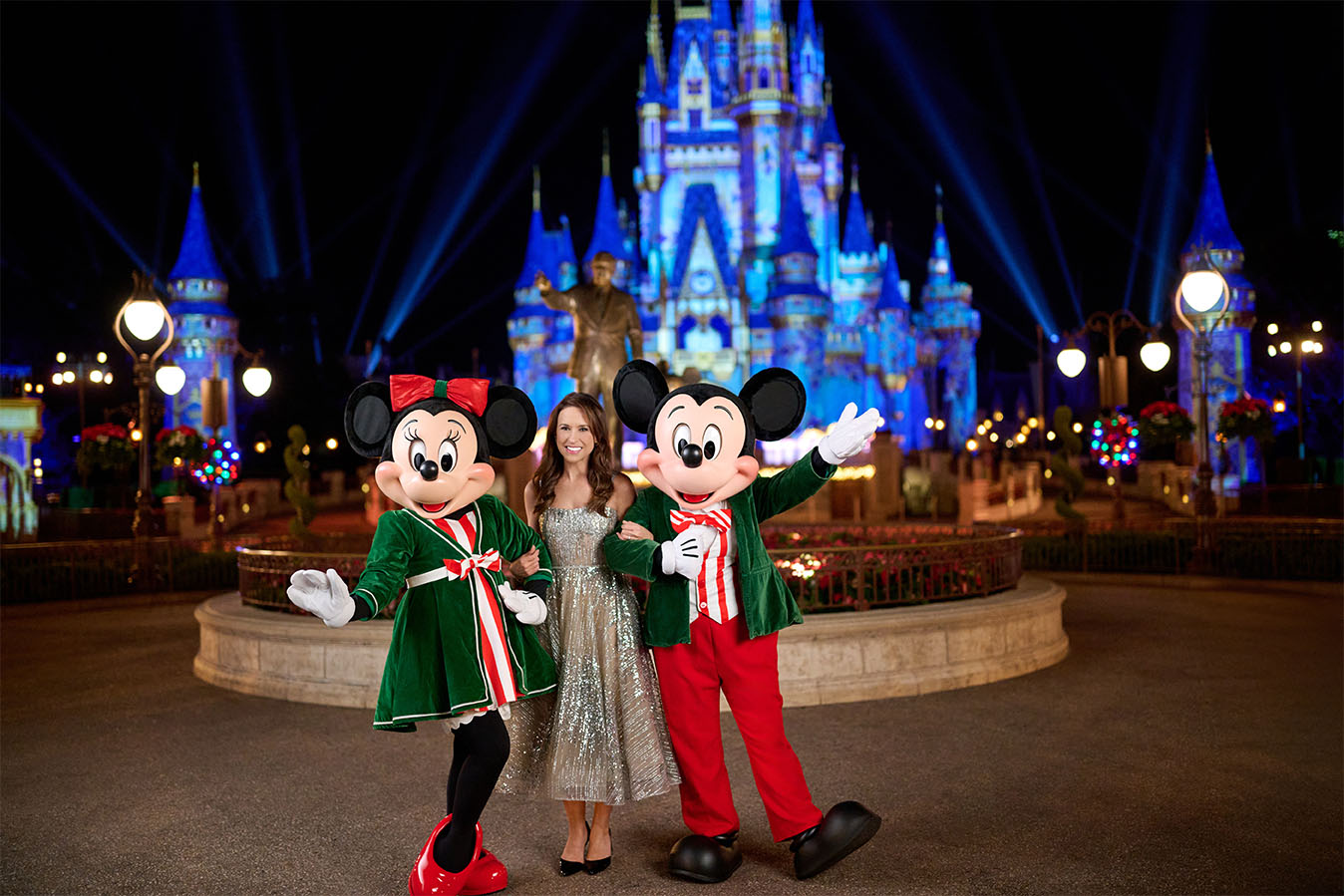 Lacey Chabert with Mickey and Minnie at Walt Disney World with castle in background