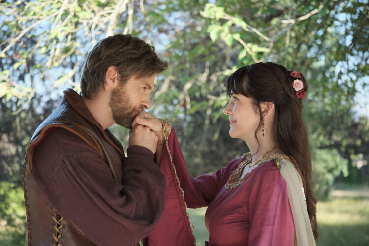 Hallmark Fall Into Love 2026: Full Schedule, Premiere Dates + Filming Locations James Trevena holding the hands of Julie Gonzalo wearing medieval dress in A Knight to Remember Hallmark Fall into love movie