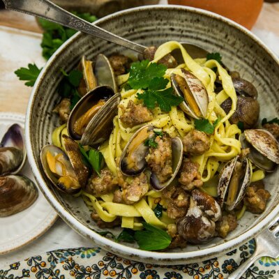 Fettuccini with Manila Clams, Spicy Sausage and White Wine Saffron Reduction